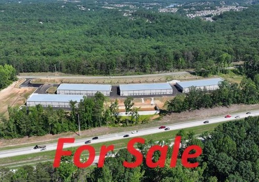 Aerial view of WeStore facility with For Sale written in red font